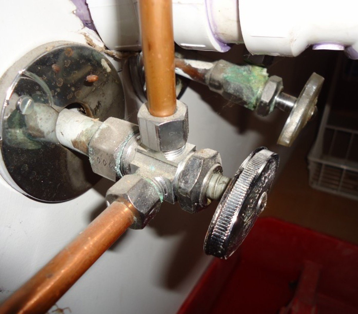 Angle stop valve installation under sink showing typical residential application