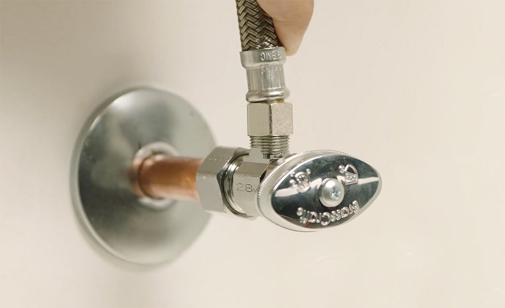 Professional installation of shut-off valve showing proper technique and positioning